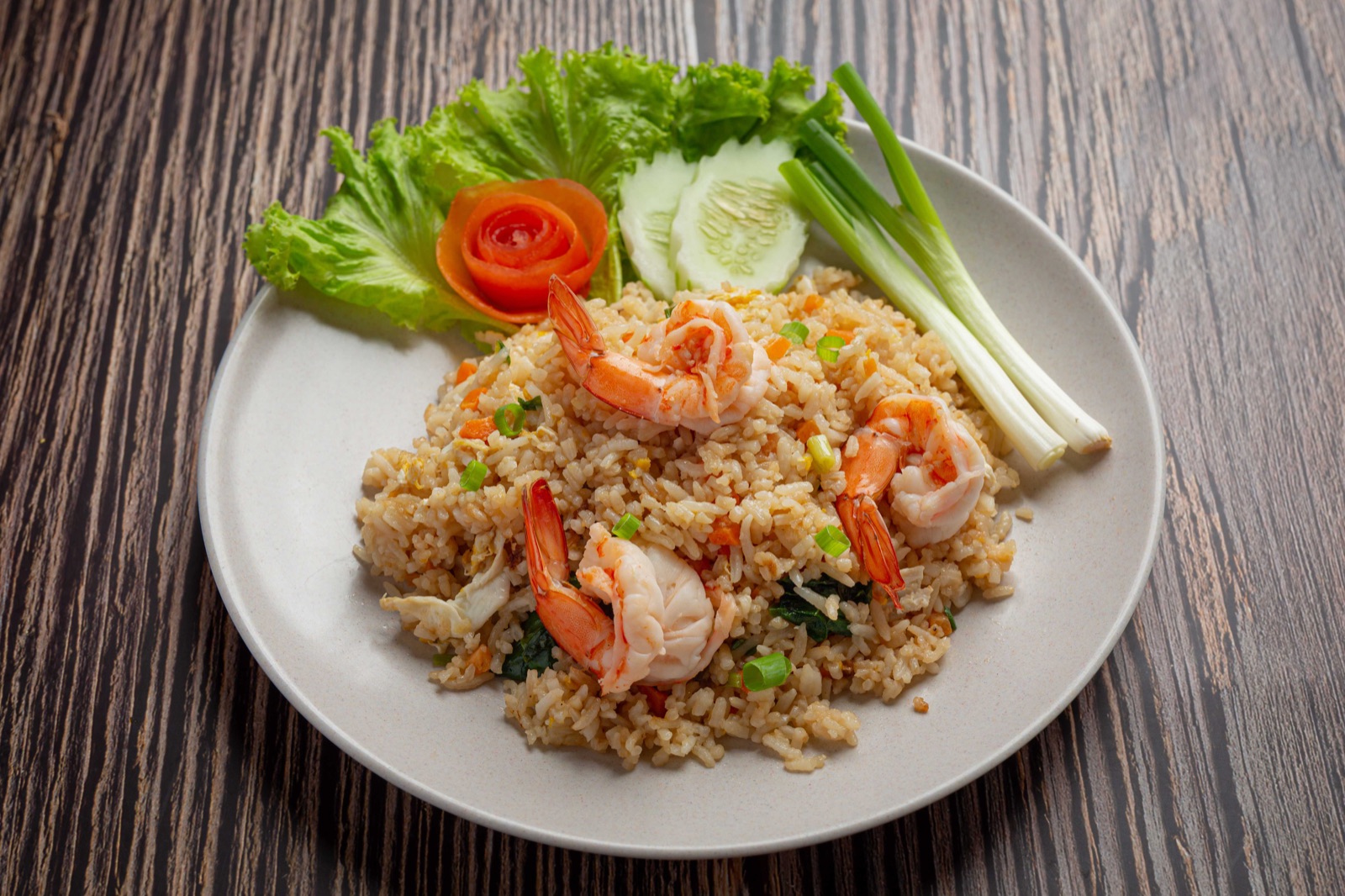 Shrimp fried rice with egg, vegetables, cucumber and scallions